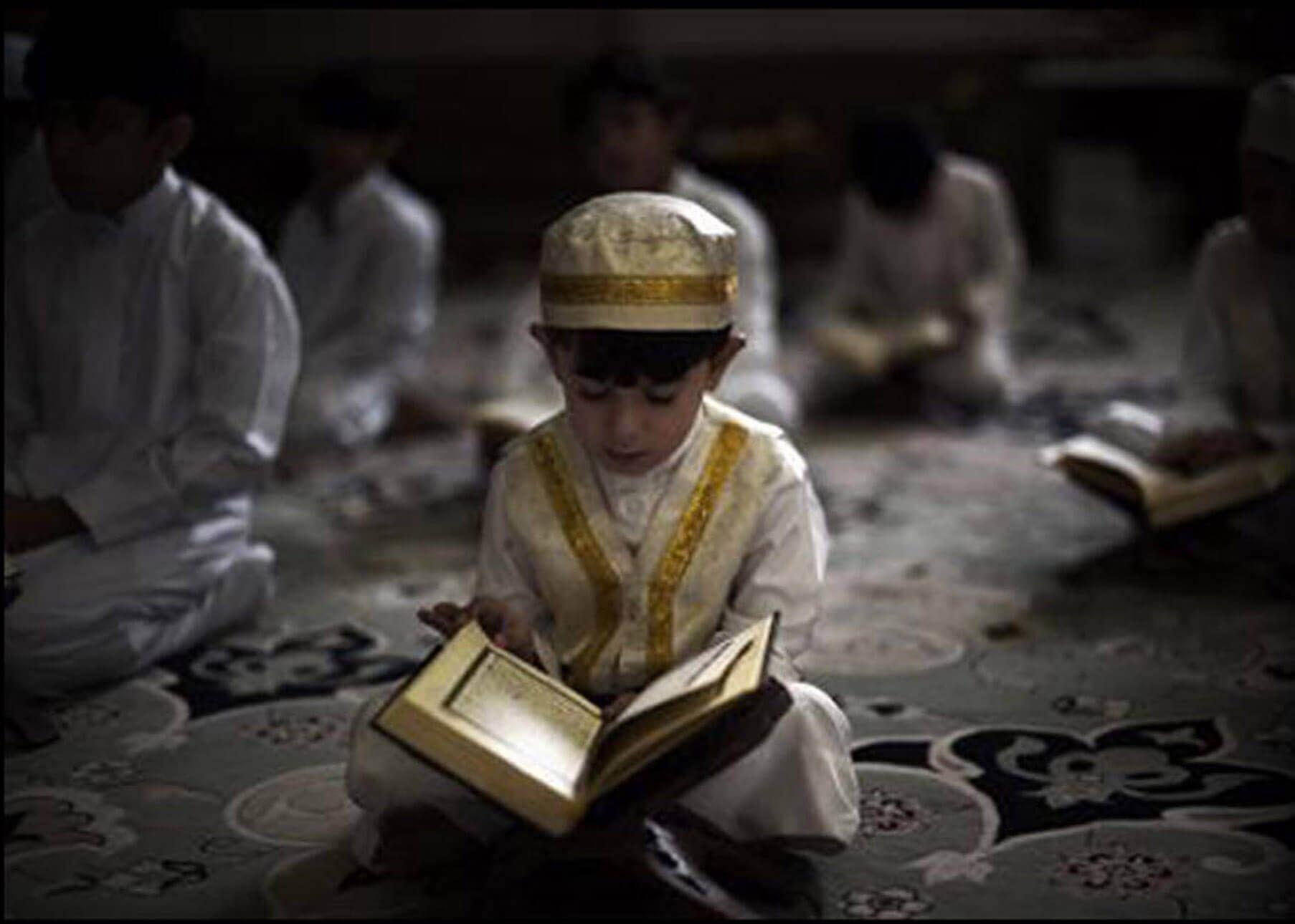 child reading quran